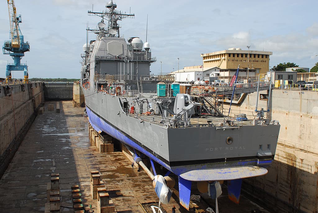 Guided-missile cruiser USS Port Royal sits in drydock at the Pearl Harbor Naval Shipyard as it is readied for repairs in Pearl Harbor, Hawaii, on Feb. 19, 2009. (Michael F. Laley/U.S. Navy via Getty Images)