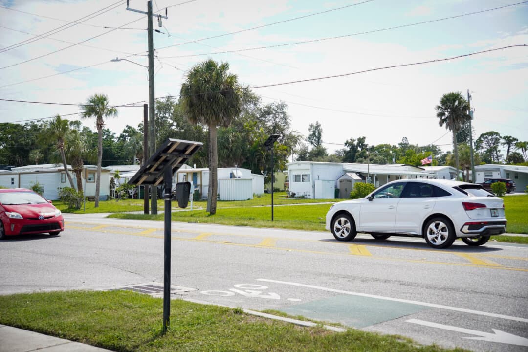 Flock Safety cameras are installed on either side of Bradenton Road in Sarasota, Fla., on Aug. 21, 2026. (Jacob Burg/The Epoch Times)