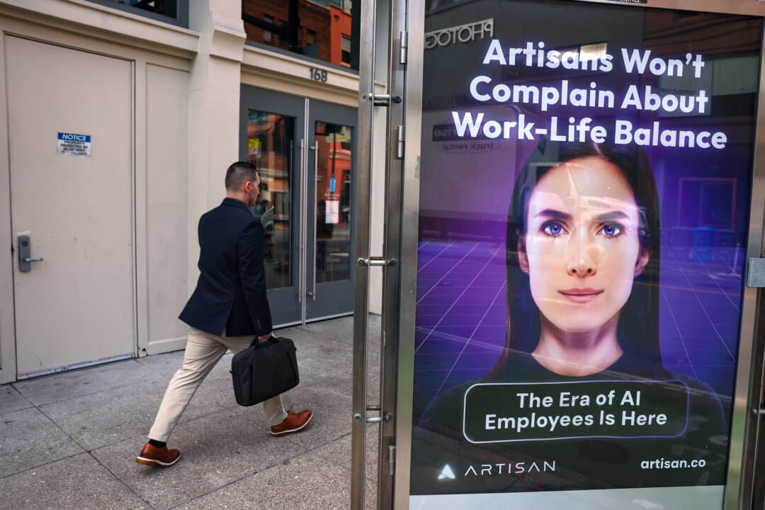An advertisement for AI company Artisan is posted in San Francisco on Dec. 5, 2024. Predictions from AI moguls that the technology will soon replace human beings can be marketing in disguise if it becomes a self-fulfilling prophecy. (Justin Sullivan/Getty Images)