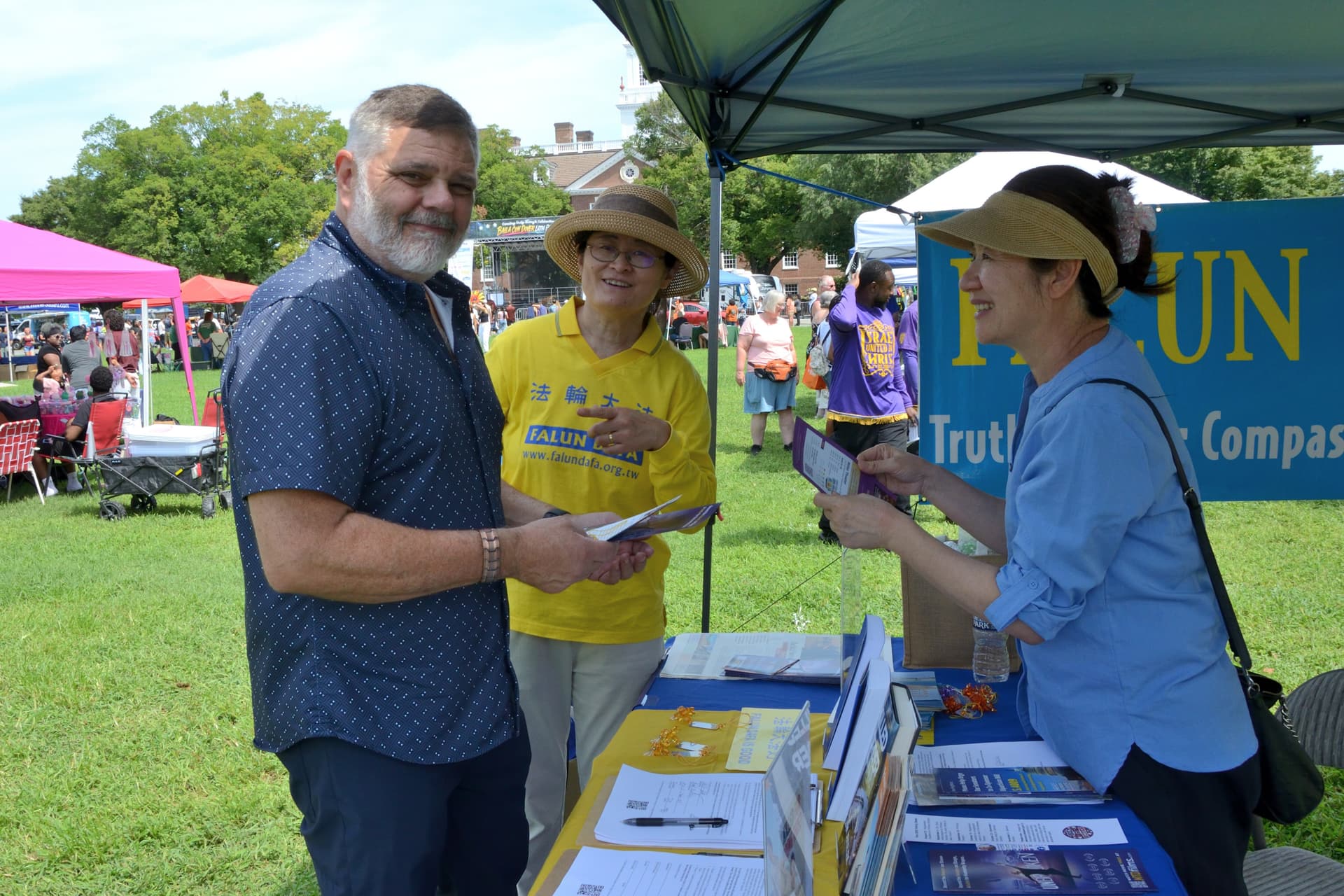 Dr. Robert Buckley (L), DACRB Clinical Director, at the 4th annual Baila Con Dover Latin Festival on Aug. 29, 2026. (Frank Liang/The Epoch Times)