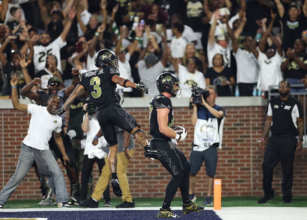 Charlie Williams #87 of the Colorado Buffaloes reacts with DeAndre Moore Jr. #3 after scoring the game-tying touchdown against the Georgia Tech Yellow Jackets during the fourth quarter at Bobby Dodd Stadium in Atlanta, Ga., on Sept. 03, 2026. (Kevin C. Cox/Getty Images)