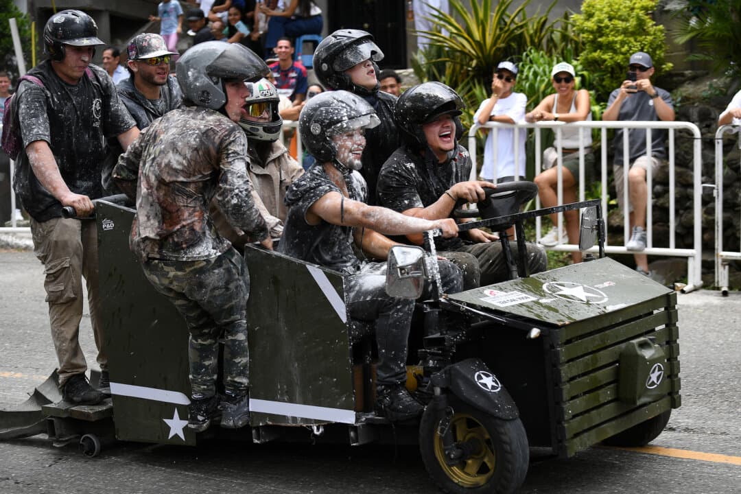 Revelers compete in a downhill makeshift car fun race during the Festival de Descenso y Adrenalina in Medellín, Colombia, on Aug. 30, 2026. (Jaime Saldarriaga/AFP via Getty Images)
