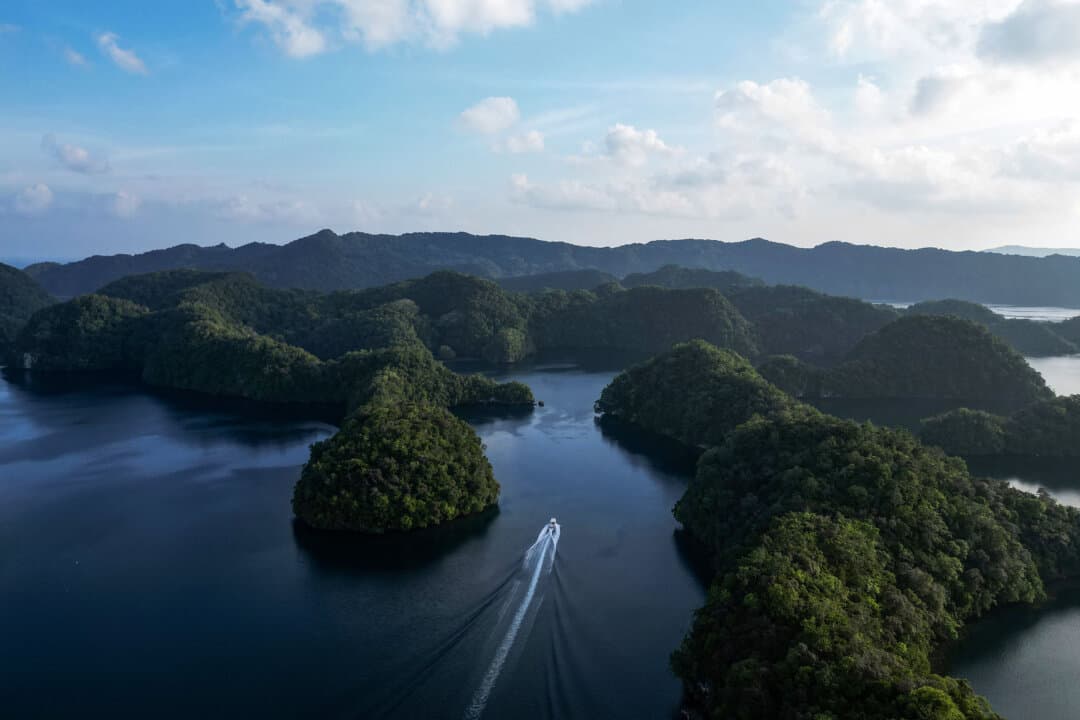 A boat sails past islands in Koror, Palau, on Aug. 30, 2026. (Saeed Khan/AFP via Getty Images)