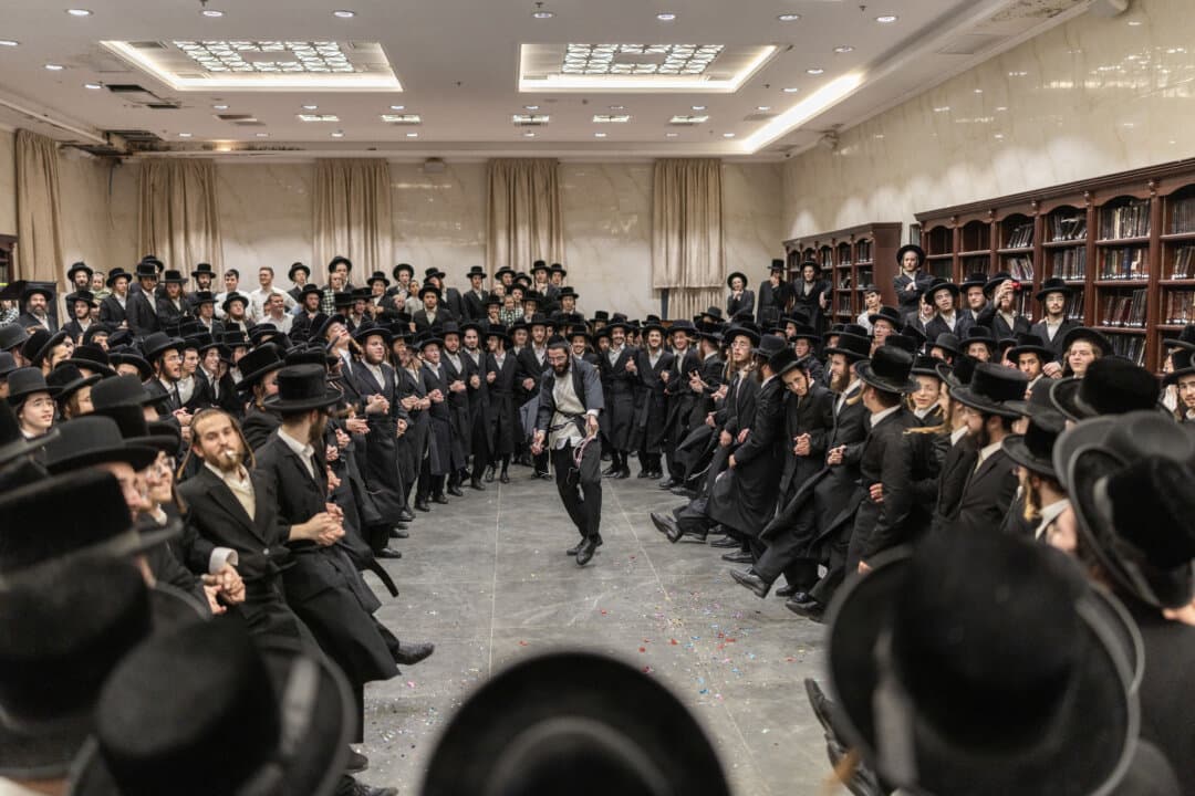 Ultra-Orthodox Jewish men dance as they celebrate the release of a fellow yeshiva student from military prison after he was detained for failing to report for military service, in Elad, Israel, on Aug. 31, 2026. (Ilia Yefimovich/AFP via Getty Images)