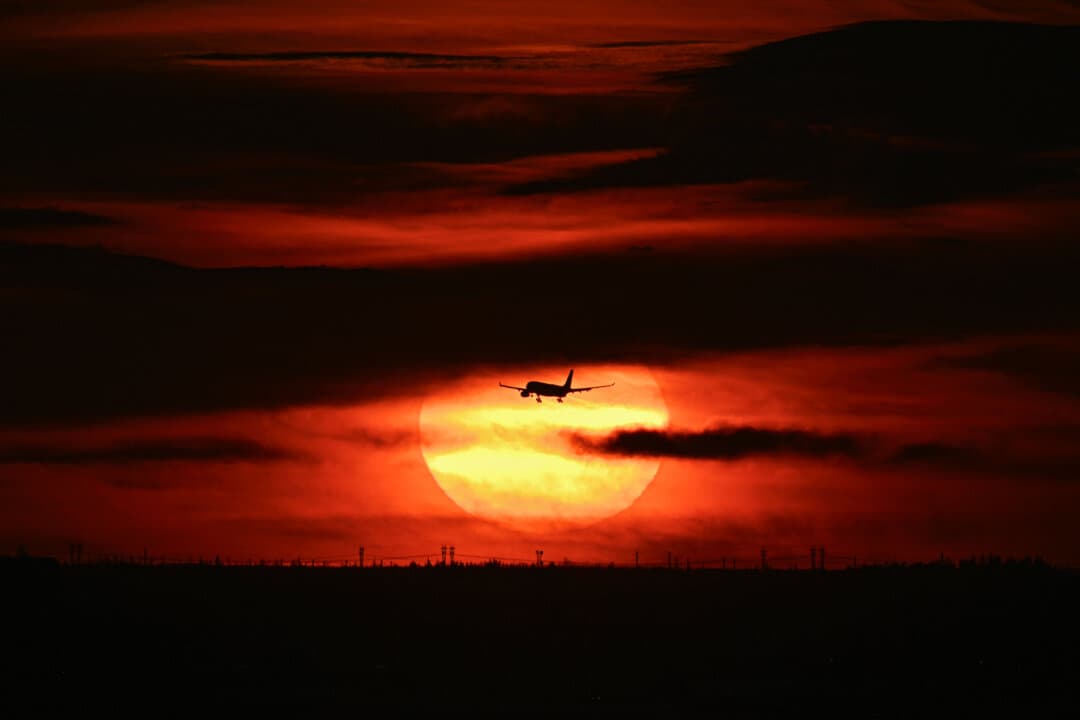 A silhouette of an airplane is seen against the setting sun as it lands at Miami International Airport, in Miami, on Sept. 2, 2026. (Chandan Khanna/AFP via Getty Images)