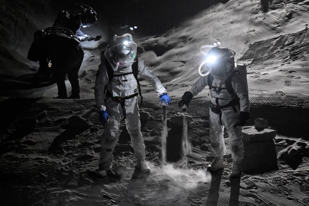 Scientists test spacesuits during a press event at the new LUNA lunar simulation facility at the German Aerospace Center campus near the European Space Agency's European Astronaut Centre, in Cologne-Porz, Germany, on Sept. 3, 2026. (Ina Fassbender/AFP via Getty Images)