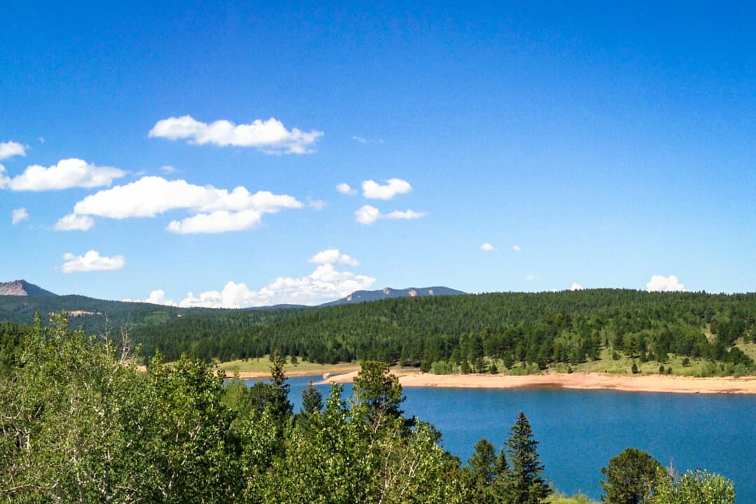 (Left) The Flaming Gorge Reservoir, on the border between Wyoming and Utah, on Sept. 23, 2014. The reservoir, located in the Colorado River's Upper Basin, is currently at 71 percent of its capacity. (Center) Crystal Creek Reservoir in the Pike National Forest below Pike's Peak, Colo.,on Aug. 28, 2013. The Upper Basin reservoir is currently at 89 percent of its capacity. (Right) The Morrow Point Reservoir in Cimarron, Colo., in the Colorado River's Upper Basin, in this file photo. The reservoir is at 97 percent of capacity. (Paul Hermans/CC BY-SA 3.0, Fredlyfish4/CC BY-SA 3.0, Nationalparks/CC BY-SA 2.5)