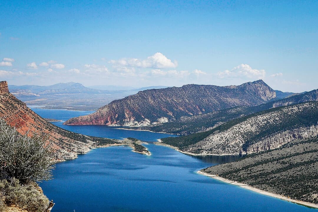 (Left) The Flaming Gorge Reservoir, on the border between Wyoming and Utah, on Sept. 23, 2014. The reservoir, located in the Colorado River's Upper Basin, is currently at 71 percent of its capacity. (Center) Crystal Creek Reservoir in the Pike National Forest below Pike's Peak, Colo.,on Aug. 28, 2013. The Upper Basin reservoir is currently at 89 percent of its capacity. (Right) The Morrow Point Reservoir in Cimarron, Colo., in the Colorado River's Upper Basin, in this file photo. The reservoir is at 97 percent of capacity. (Paul Hermans/CC BY-SA 3.0, Fredlyfish4/CC BY-SA 3.0, Nationalparks/CC BY-SA 2.5)