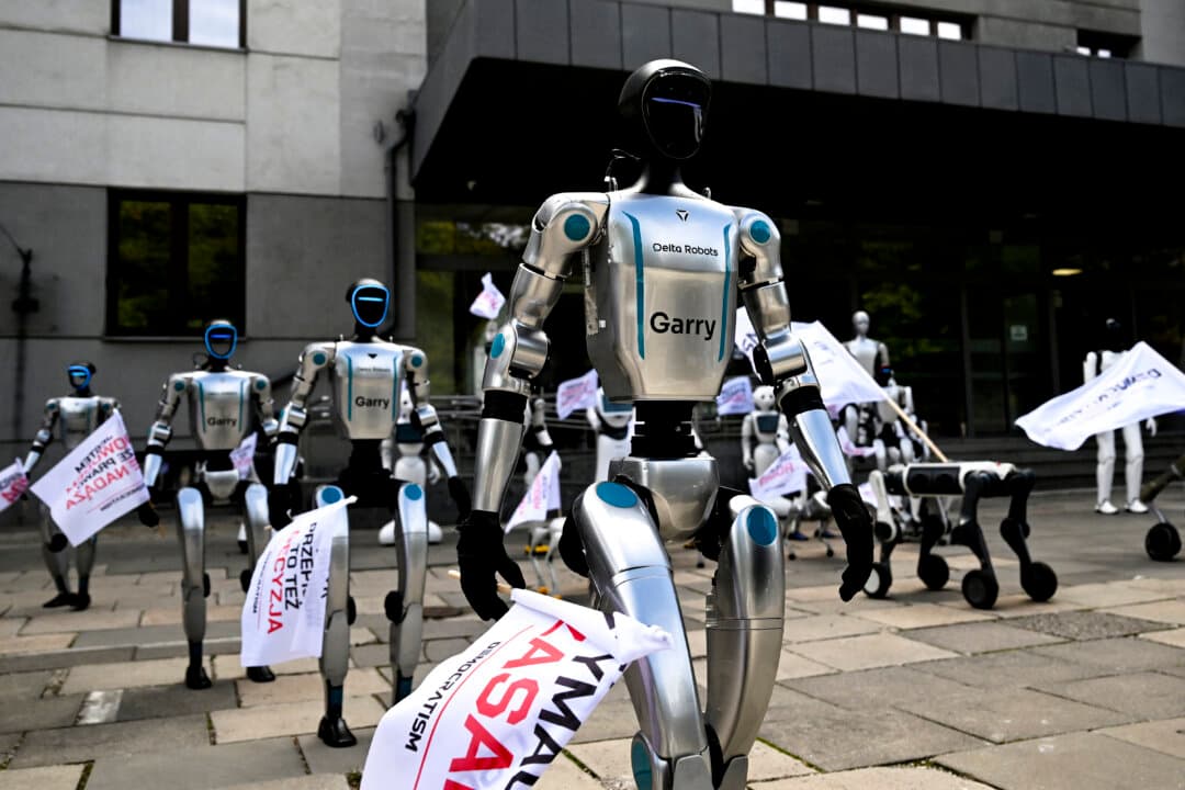 Humanoid and quadruped robots attend a demonstration calling for the regulation of artificial intelligence development in Warsaw, Poland, on Sept. 7, 2026. Waving flags, "chanting" slogans, and marching in circles, around 30 robots took to the streets to raise awareness for AI regulation in front of the digital affairs ministry on Sept. 7, 2026. (Sergei Gapon/AFP via Getty Images)