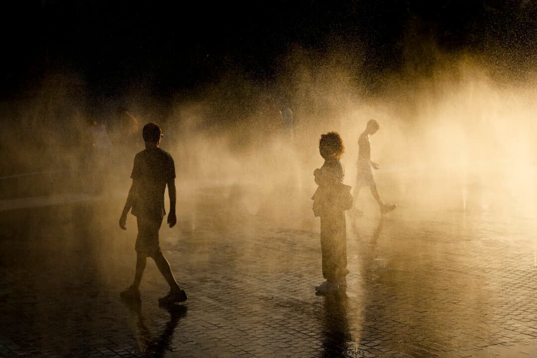 People cool off at fountains in Madrid Rio district in the Spanish capital during a heat wave, on Sept. 6, 2026. (Oscar Del Pozo/AFP via Getty Images)