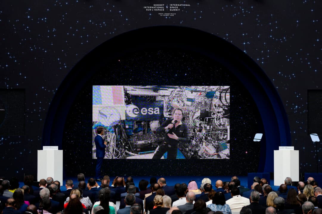 France's President Emmanuel Macron listens to French astronaut Sophie Adenot during a live video connection from the International Space Station at the International Space Summit at the Grand Palais in Paris on Sept. 10, 2026. (Aurelien Morissard/POOL/AFP via Getty Images)