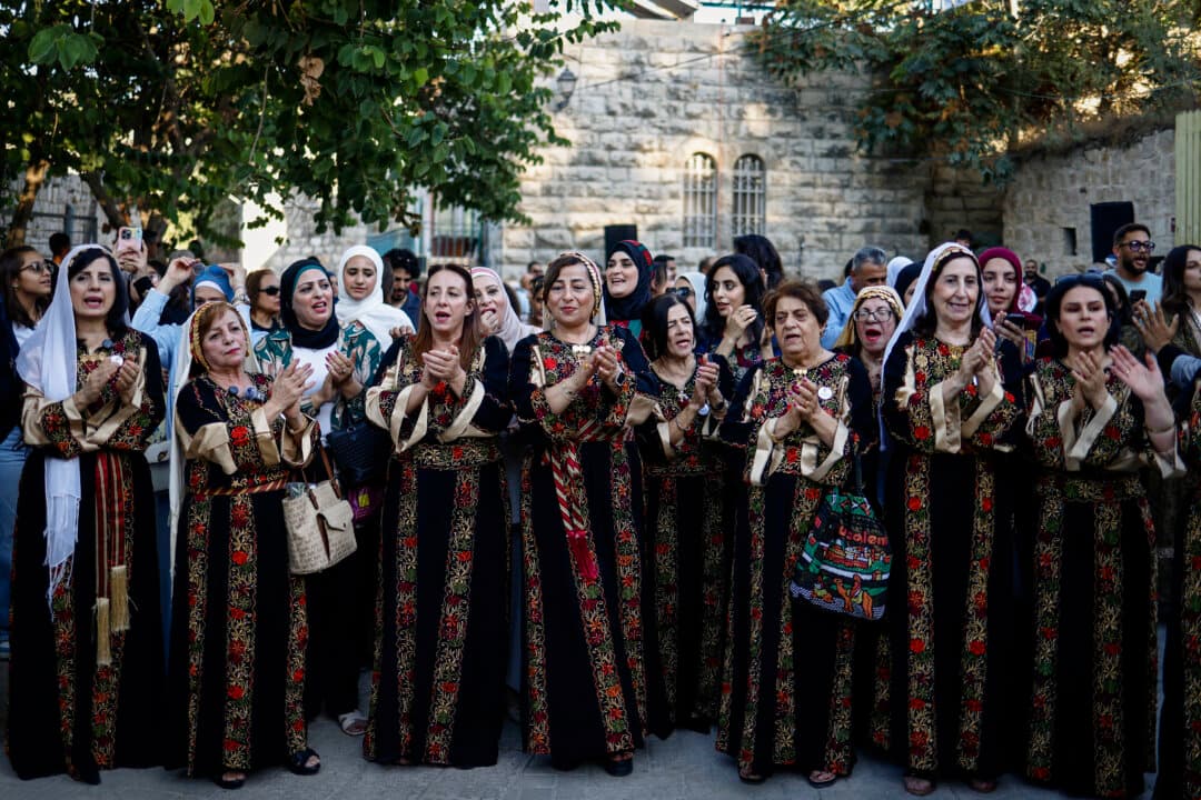 Family members and relatives of a couple attend their wedding ceremony in a traditional Palestinian style, in the town of Birzeit, north of Ramallah, in the Israeli-occupied West Bank on Sept. 9, 2026. (Zain Jaafar/AFP via Getty Images)