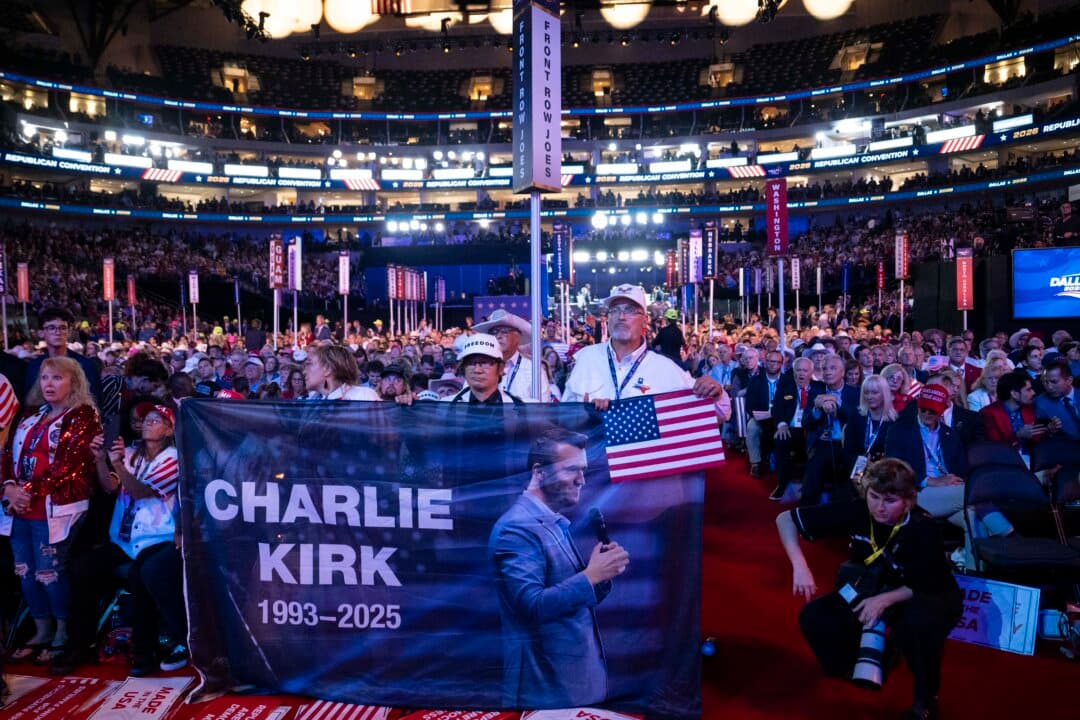 Attendees hold a banner to commemorate the late Charlie Kirk during the second day of the 2026 Republican National Committee Midterm Convention in Dallas on Sept. 10, 2026. (Madalina Kilroy/The Epoch Times)