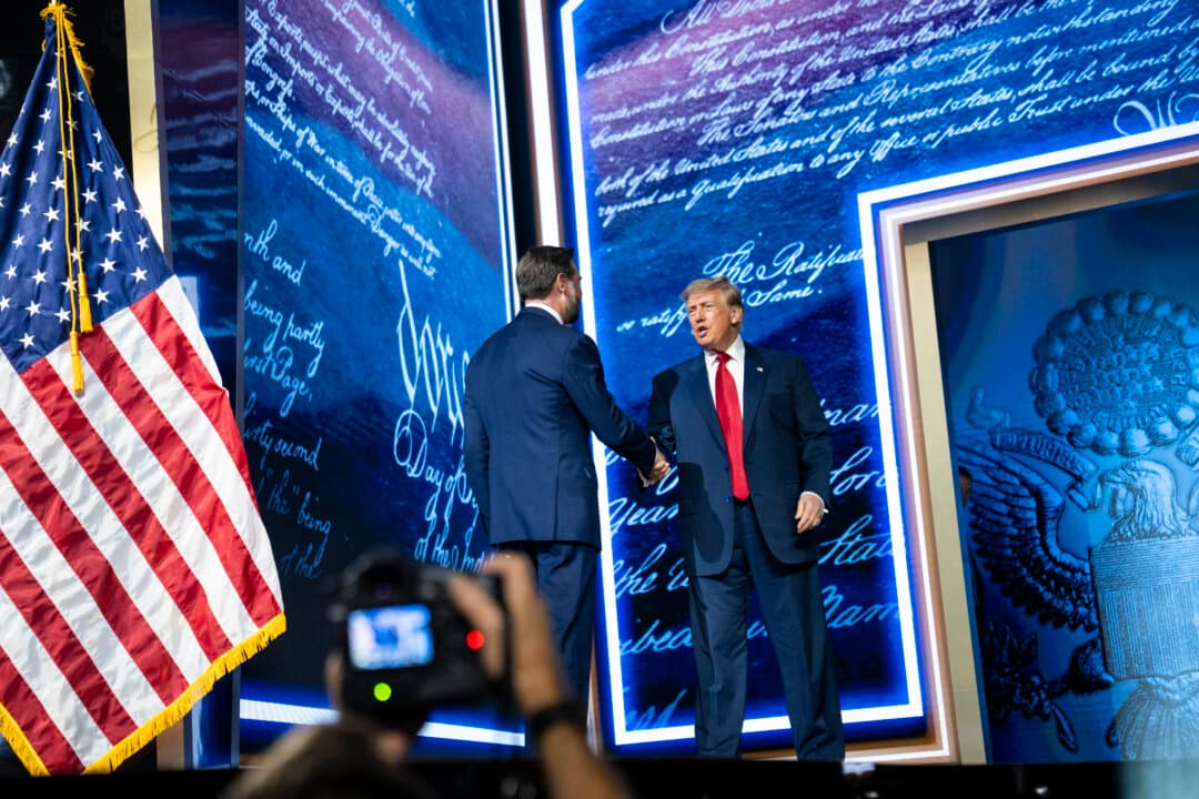 President Donald Trump and Vice President JD Vance shake hands at the second day of the 2026 Republican National Committee Midterm Convention in Dallas on Sept. 10, 2026. (Madalina Kilroy/The Epoch Times)