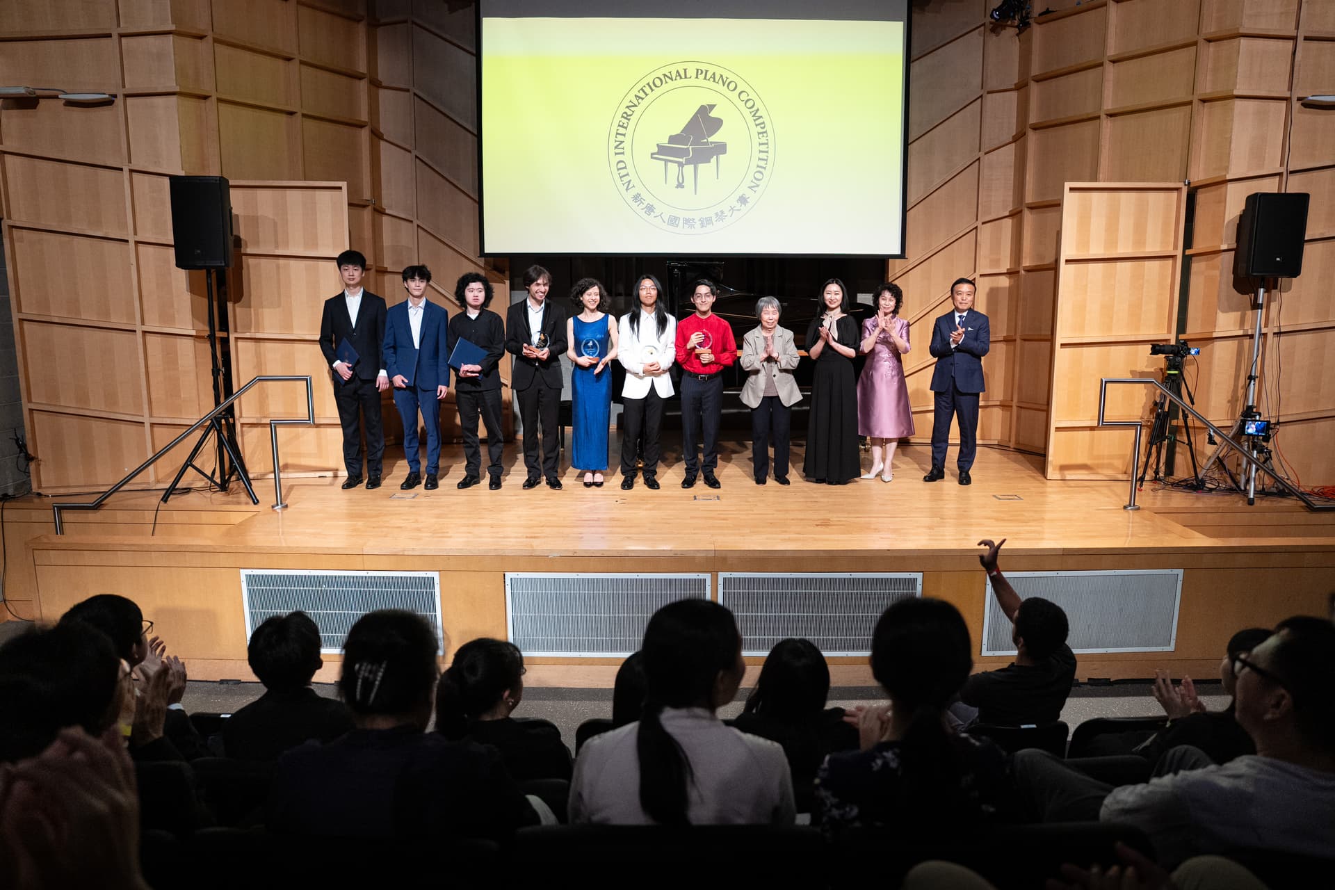 Award winners and presenters of NTD's Eighth International Piano Competition pose for a photo on the stage of the Engelman Recital Hall in New York City on Sept. 5, 2026. (Larry Dai/The Epoch Times)
