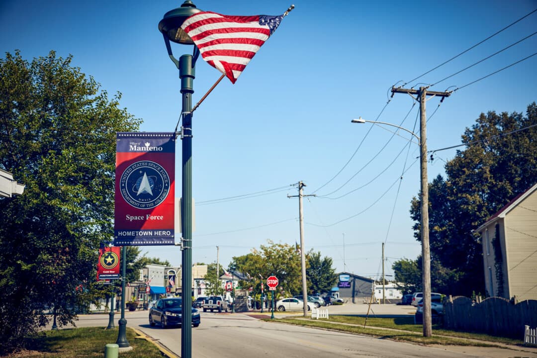 Streetlamp banners honor hometown heroes in Manteno, Ill., on Sept. 3, 2026. (Nathaniel Smith for The Epoch Times)
