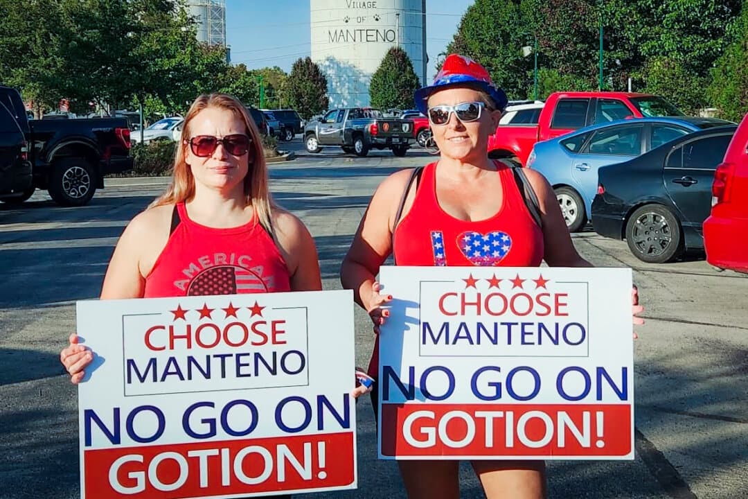 (Top Left) Activists Jillian Rojas, Amanda Piker, and a fellow community member hold signs during a protest walk in Manteno, Ill., on Oct. 22, 2023. (Top Right) Activist Ann Gates protests outside the battery plant location in Manteno, Ill., on Sept. 8, 2023—the day Illinois Gov. JB Pritzker announced the project. (Bottom Left) Darrel Bruck, founder of a Kankakee County group that opposes the Gotion battery plant, holds a sign at a protest and news conference outside Manteno Village Hall in Manteno, Ill., on Oct. 2, 2023. (Bottom Right) Manteno residents hold signs voicing opposition to the Gotion battery plant, in this file photo. (Courtesy of Amanda Piker, Courtesy of Concerned Citizens of Manteno)