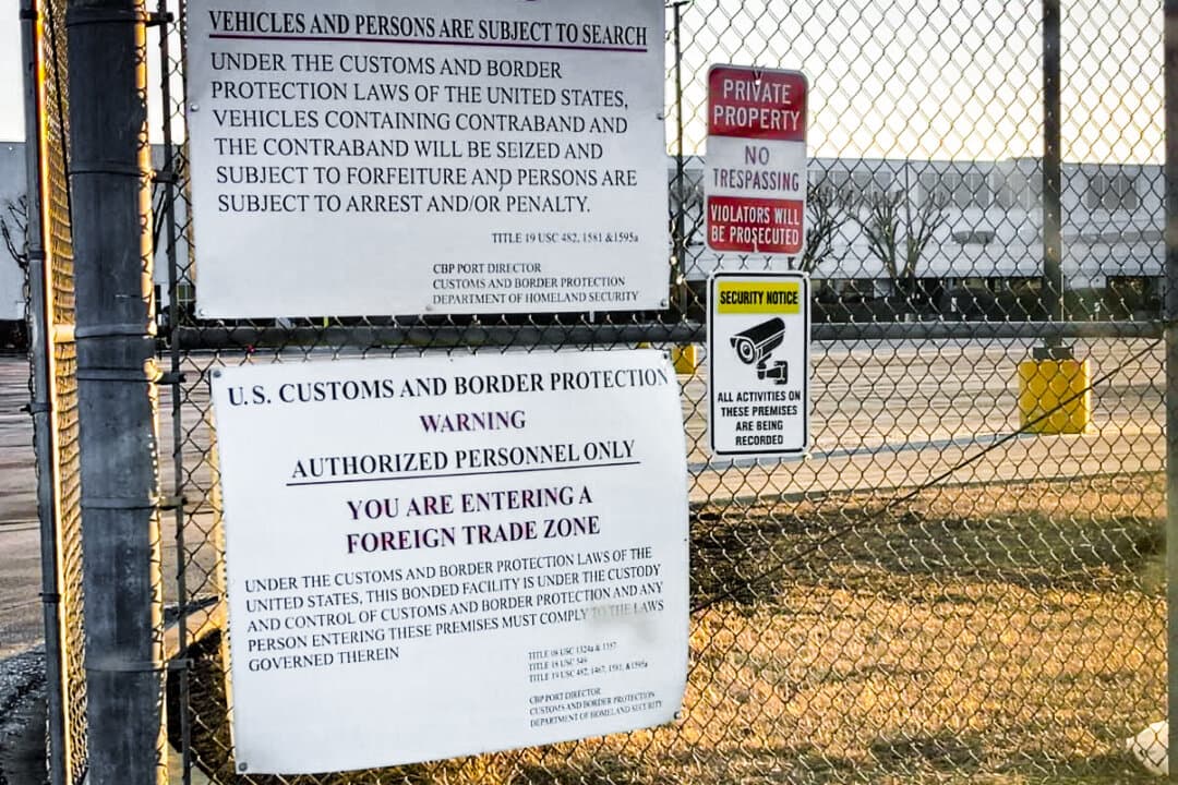A sign warns visitors at the gate of the Gotion battery plant in Manteno, Ill., in summer 2025. The plant was declared a foreign trade zone, allowing Gotion to manufacture lithium battery packs and systems with reduced customs costs and operational flexibility. (Courtesy of Julie Holda)