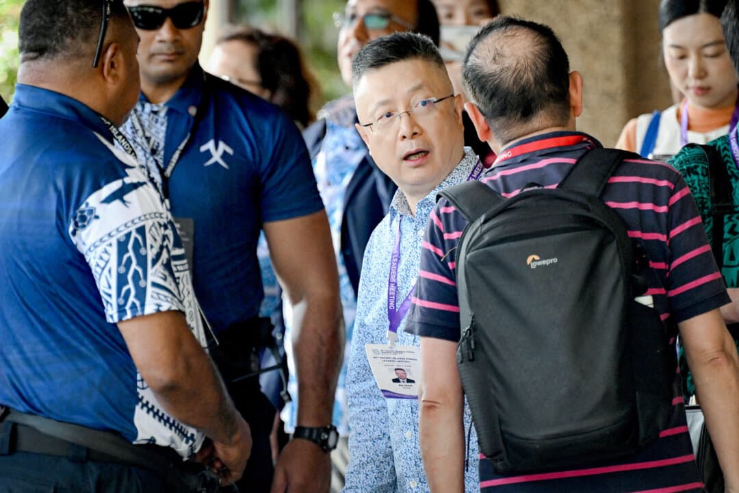 Qian Bo, China's special envoy for Pacific affairs (C), leaves the 55th Pacific Islands Forum leaders' meeting in Koror, Palau, on Sept. 1, 2026. (Saeed Khan/AFP via Getty Images)