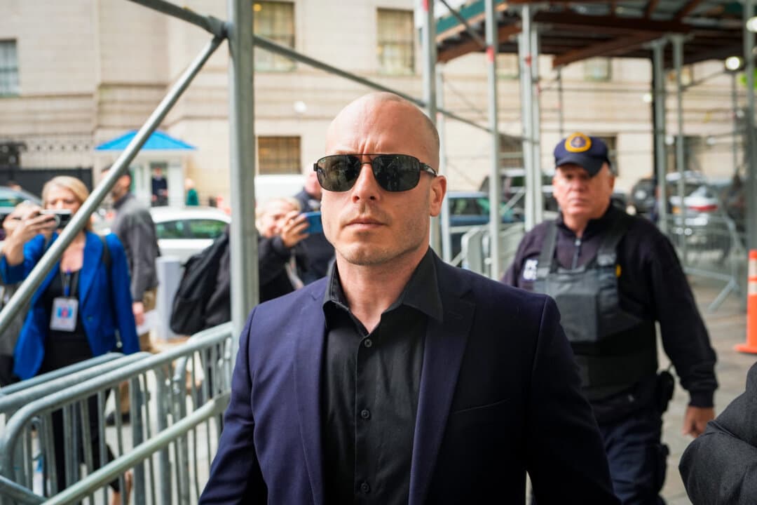 Gannon Ken Van Dyke leaves a federal court building in New York on April 28, 2026. The former special operations soldier is alleged to have used inside knowledge to make lucrative Polymarket wagers on the capture of Venezuelan leader Nicolás Maduro. (Ryan Murphy/AP Photo)