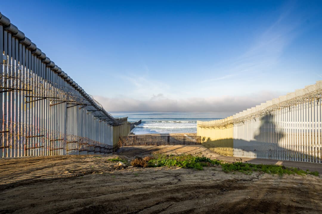 The U.S. border wall ends in the Pacific Ocean outside San Diego, on Jan. 20, 2026. (John Fredricks/The Epoch Times)