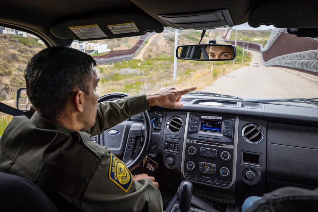 San Diego Border Patrol chief Justin De La Torre drives along the southern border wall outside San Diego on May 27, 2026. (John Fredricks/The Epoch Times)