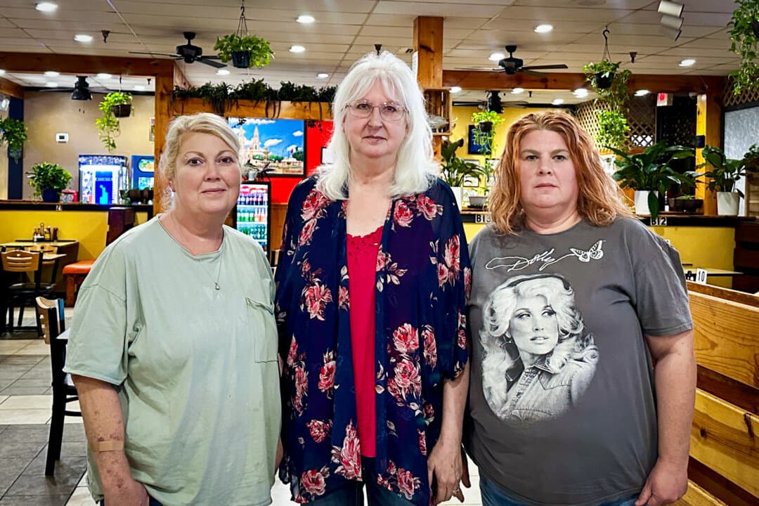 Alpha-gal sufferers (L–R) Heather Coomer, Mackie Jo Pennington, and Missy Harvey, at a restaurant in Columbia, Ky., on Aug. 28, 2026. The women said they sometimes have to bring their own food when they eat out. (Darlene McCormick Sanchez/The Epoch Times)