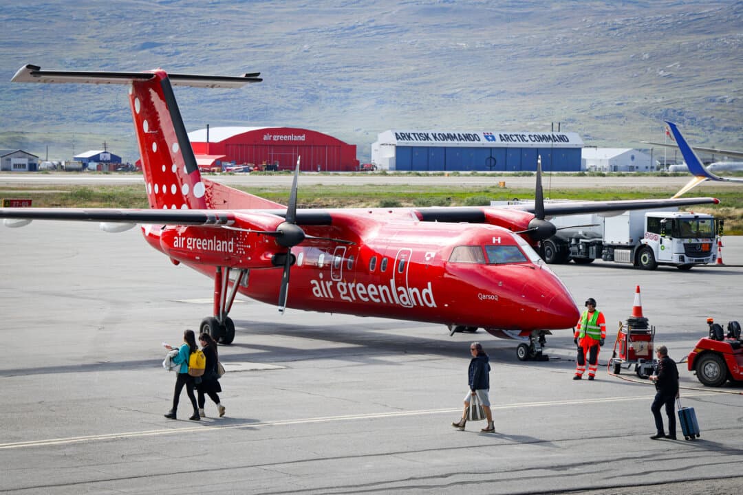 Travelers board an Air Greenland passenger plane in Kangerlussuaq, Greenland, on July 21, 2026. Louisiana Gov. Jeff Landry has noted Greenland's’ similarities with Louisiana, with both communities known for abundant fisheries, natural resources, and making the best out of challenging situations. (Sean Gallup/Getty Images)