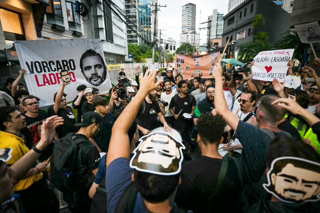 Demonstrators from the Movimento Brasil Livre protest in front of the Banco Master building in São Paulo on Feb. 5, 2026, after the Central Bank of Brazil ordered its shutdown because of a major liquidity crunch and serious violations of financial regulations. (Nelson Almeida/AFP via Getty Images)