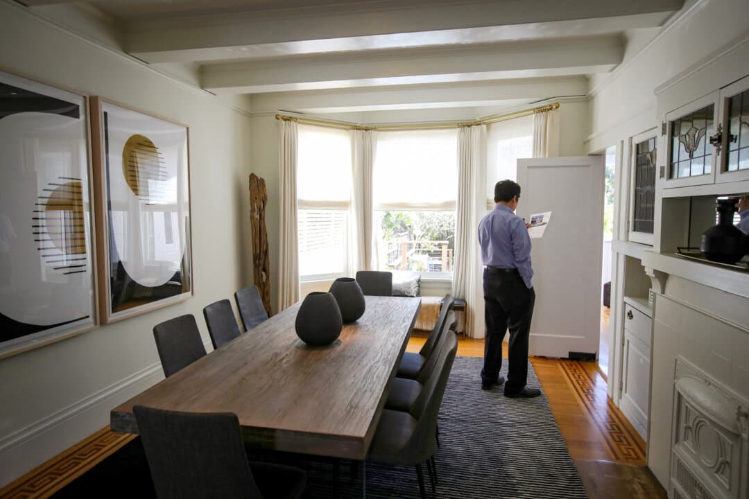 A real estate agent tours a home for sale during a broker open house in San Francisco on April 16, 2019. (Justin Sullivan/Getty Images)