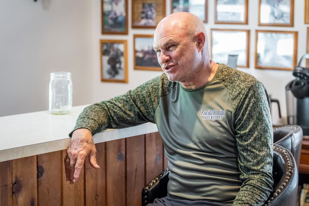 Ian Hall in the lodge at Florida Hunting, Fishing, and Outoor Adventures in Okeechobee, Fla., on July 24, 2026. (Natasha Holt for The Epoch Times)