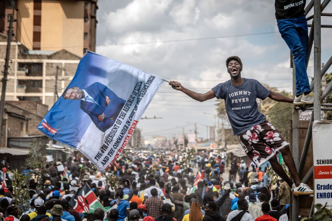 A supporter of Kenyan opposition figure and Nairobi Sen. Edwin Sifuna holds a flag depicting him as the next Kenyan president as crowds rally in Nairobi, Kenya, on Sept. 13, 2026. (Luis Tato/AFP via Getty Images)