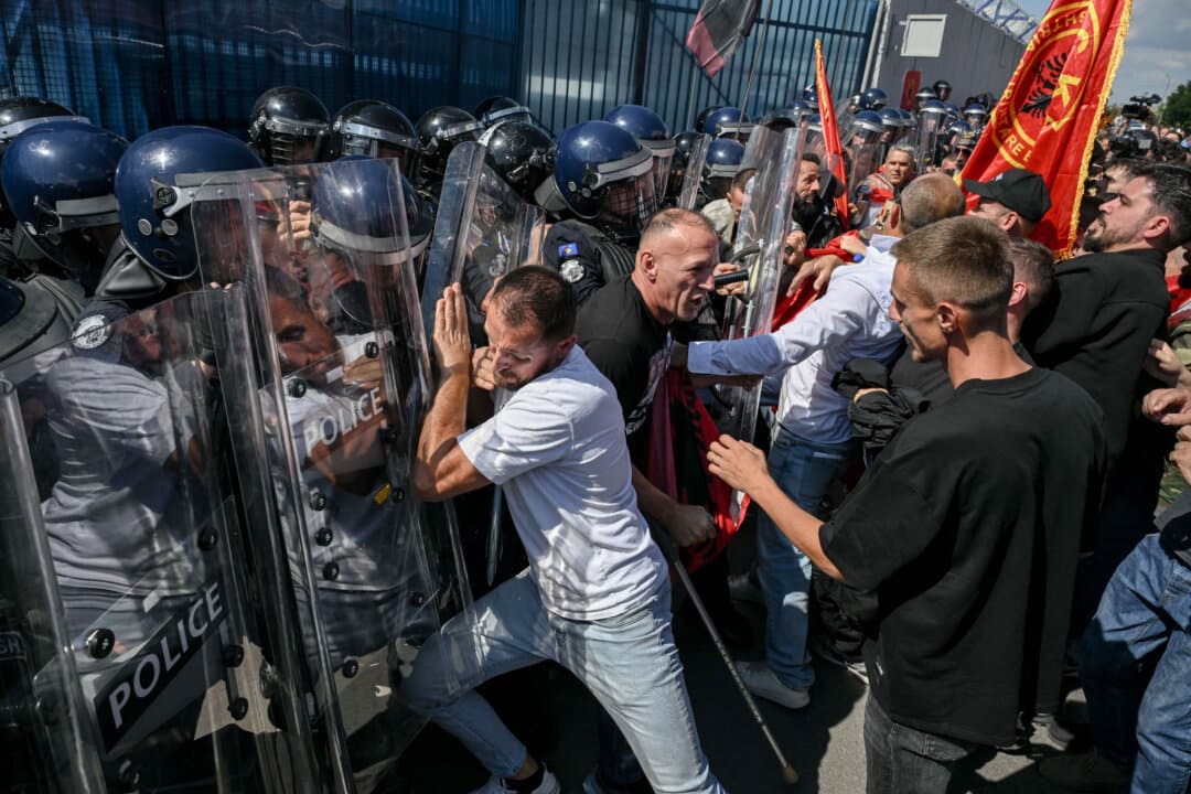 Protesters scuffle with Kosovo riot police outside the EULEX headquarters following the sentencing of Kosovo's former President Hashim Thaci, in Pristina, Kosovo, on Sept. 16, 2026. (Armend Nimani/AFP via Getty Images)