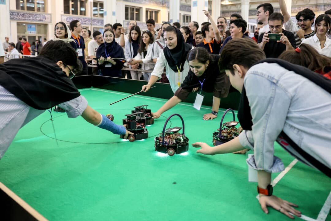Iranian female students compete in a robotics challenge during the RoboCup IranOpen event at Tehran's Mosallah Mosque on Sept. 17, 2026. (AFP via Getty Images)