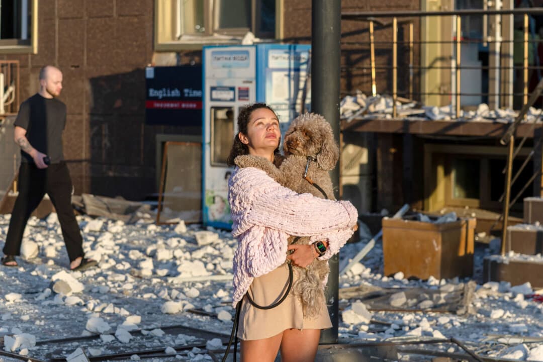 A local resident stands outside a damaged multi-story residential building following aerial attacks that injured 17 people in Odesa, Ukraine, on Sept. 12, 2026. (Oleksandr Gimanov/AFP via Getty Images)