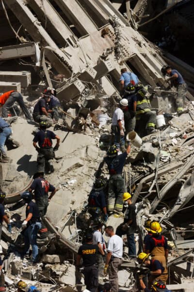 A "bucket brigade" works to clear rubble and debris, hoping to find survivors of the deadly terrorist attack on the World Trade Center that occurred on Sept. 11, 2001. (Public Domain)