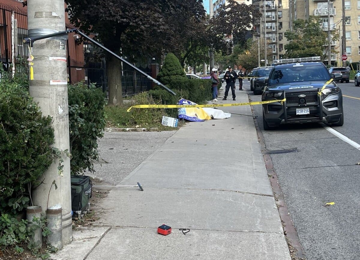 Toronto Police Service officers investigate the site outside the Chinese Consulate in Toronto where Falun Gong practitioners were attacked and their banners were forcefully removed by a man wearing a jacket with a Chinese flag, on Sept. 22, 2026. (Handout)