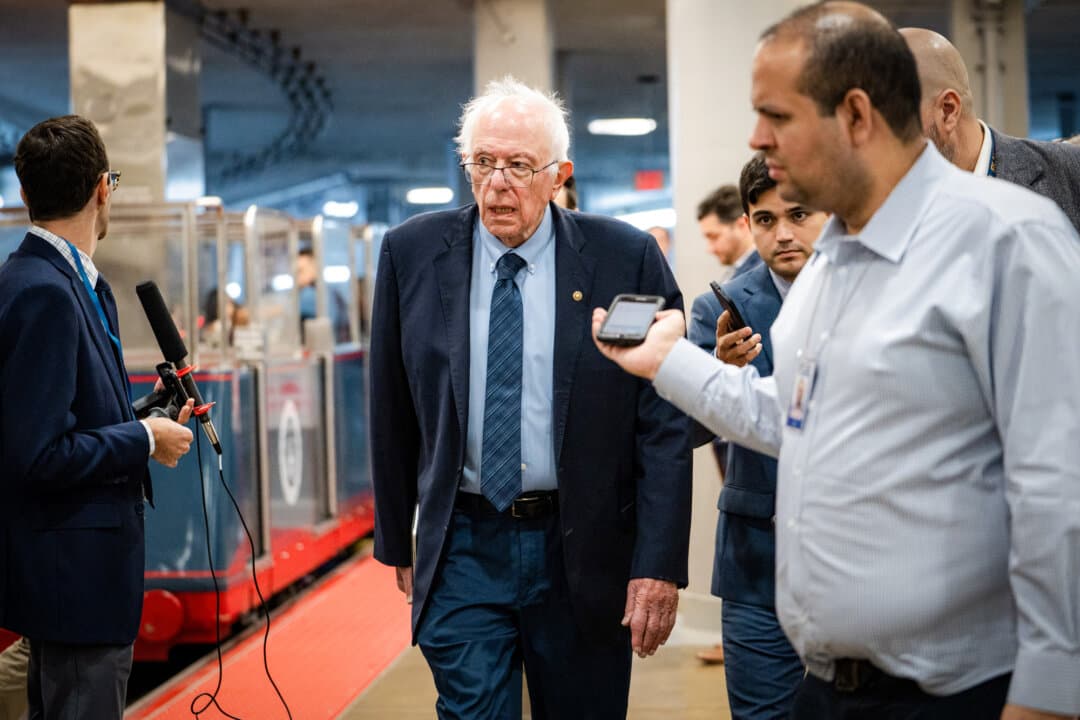 Sen. Bernie Sanders (I-Vt.) speaks to reporters on Capitol Hill in Washington on Oct. 9, 2025. Private equity investors are purchasing hospitals and “loading them up with debt that they could never afford to pay back,” Sanders said in 2024. (Madalina Kilroy/The Epoch Times)
