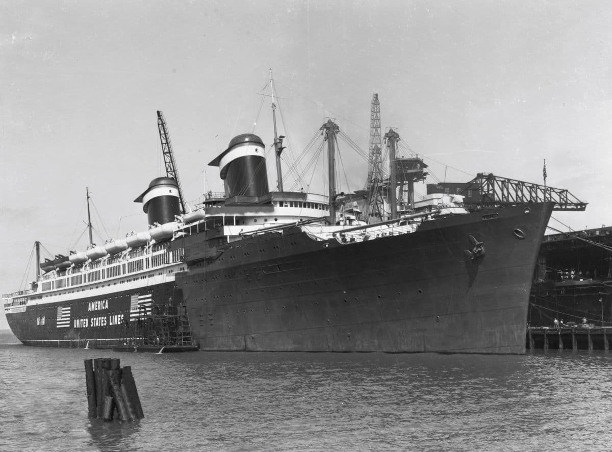 SS America in Norfolk, Va. being repainted for naval service, June 2, 1941. U.S. Navy. (Public Domain)