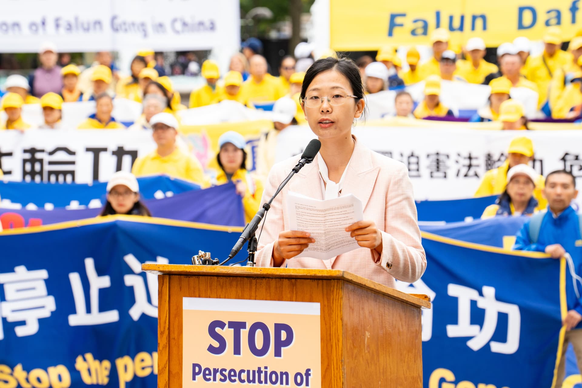 Falun Gong practitioner Alisa Zhou, whose mother Wang Youmei has been detained in China since April, speaks at a rally to demand an end to the Chinese Communist Party's persecution of Falun Gong, during Chinese leader Xi Jinping's state visit to Washington on Sept. 24, 2026.