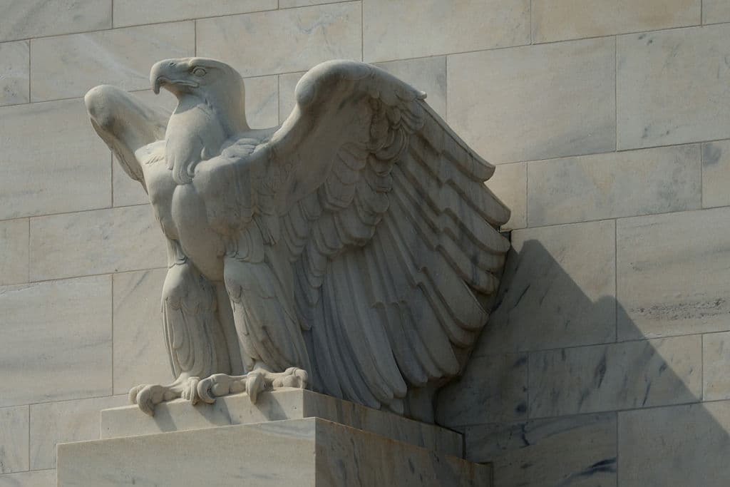 A marble American eagle sculpture sits atop the Marriner S. Eccles Federal Reserve Board Building in Washington on Aug. 13, 2026. (Alex Wong/Getty Images)