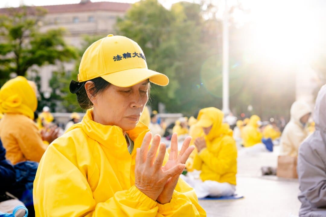 Falun Gong practitioners perform the exercises at a rally demanding an end to the Chinese Communist Party's persecution of the spiritual practice, during Chinese leader Xi Jinping's state visit to Washington on Sept. 24, 2026. (Samira Bouaou/The Epoch Times)