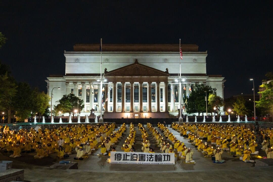 Falun Gong practitioners hold a candlelight vigil to call for an end to the Chinese Communist Party's persecution of the spiritual practice, during Chinese leader Xi Jinping's state visit to Washington on Sept. 24, 2026. (Samira Bouaou/The Epoch Times)