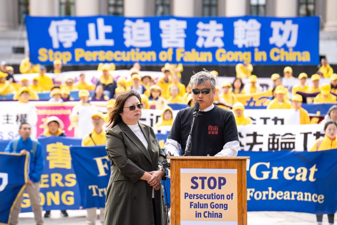 Chen Guangcheng, a blind, self-taught lawyer from northeastern China, speaks through a translator at a rally to demand an end to the Chinese Communist Party's persecution of Falun Gong, during Chinese leader Xi Jinping's state visit to Washington on Sept. 24, 2026. (Samira Bouaou/The Epoch Times)