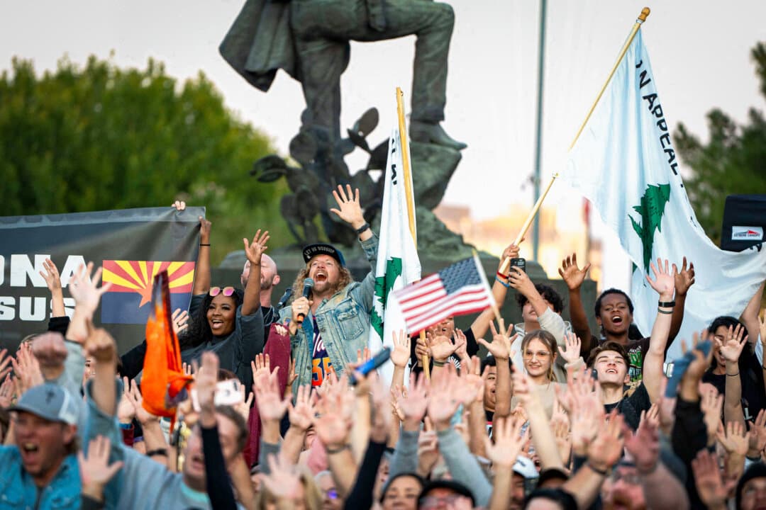Traveling evangelical musician Sean Feucht poses with congregants during the final stop of the “Kingdom to the Capitol” revival tour at Wesley Bolin Memorial Plaza outside the Arizona state Capitol in Phoenix on Oct. 19, 2024. (Rebecca Noble/AFP via Getty Images)