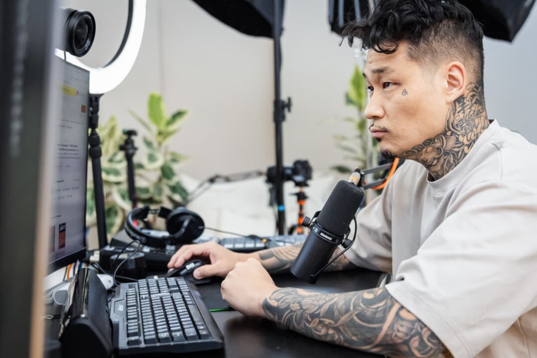 Johnny Chang preps equipment for an upcoming podcast in Los Angeles on April 30, 2026. (John Fredricks/The Epoch Times)