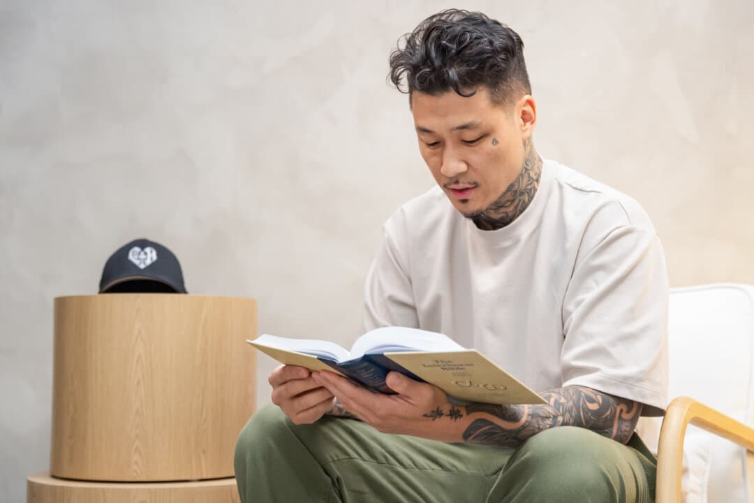 Johnny Chang reads his Bible in Los Angeles on April 30, 2026. (John Fredricks/The Epoch Times)