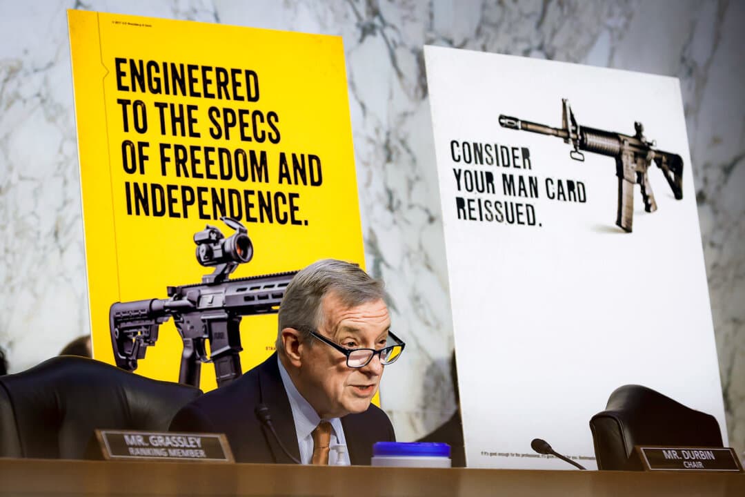 Senate Judiciary Committee Chairman Dick Durbin (D-Ill.) speaks in front of an advertisement for AR-style rifles during a hearing on the mass shooting in Highland Park, Ill., in the Hart Senate Office Building in Washington on July 20, 2022. The U.S. Supreme Court will consider on Dec. 2 whether bans on "assault weapons" in Connecticut and an Illinois county violate the Second and 14th Amendments. (Chip Somodevilla/Getty Images)