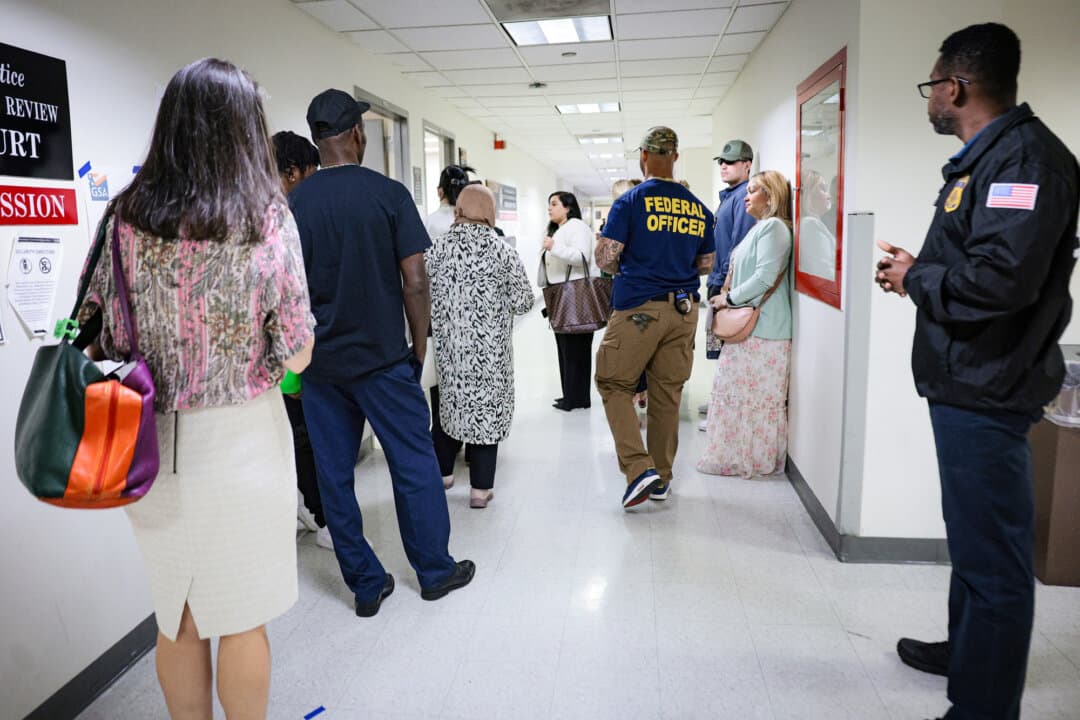 Immigration and Customs Enforcement agents patrol the halls of an immigration court as people wait for their hearings at the Jacob K. Javits Federal Building in New York on June 24, 2026. (Michael M. Santiago/Getty Images)
