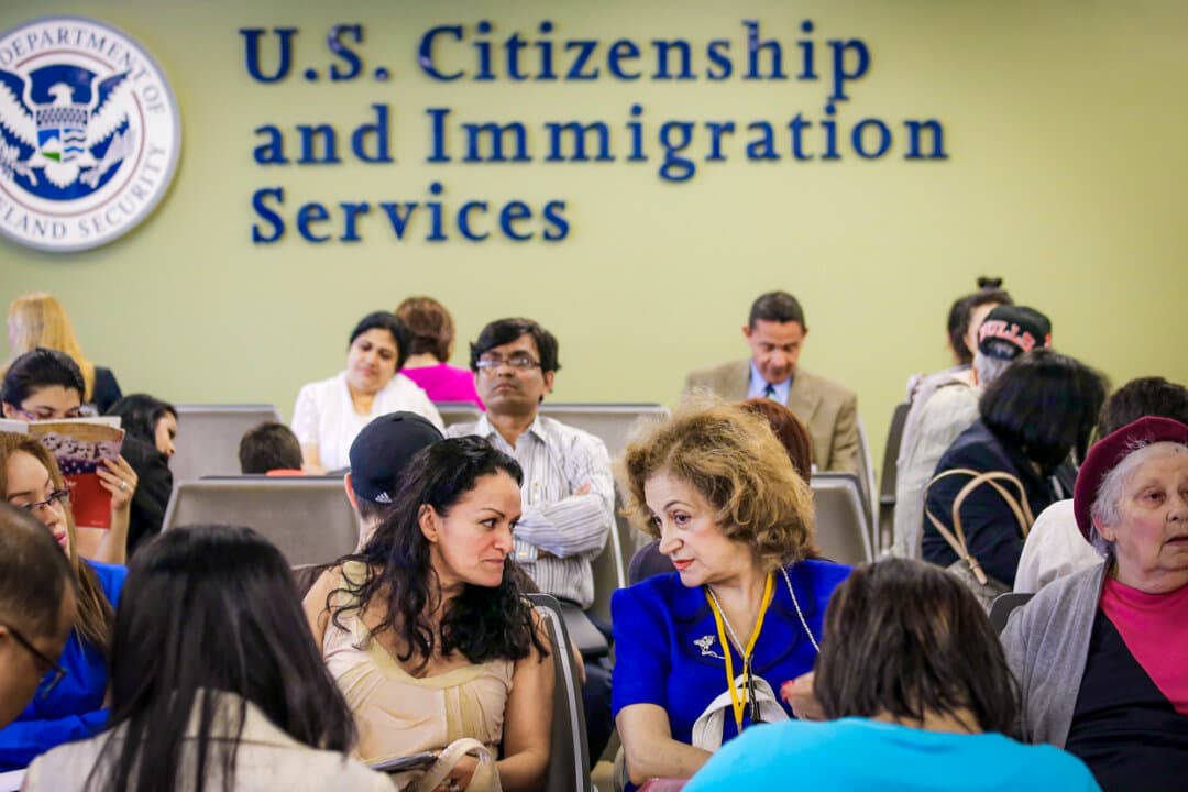 Immigrants await their turn for green card and citizenship interviews at the U.S. Citizenship and Immigration Services Queens Field Office in the Long Island City neighborhood of New York on May 30, 2013. (John Moore/Getty Images)
